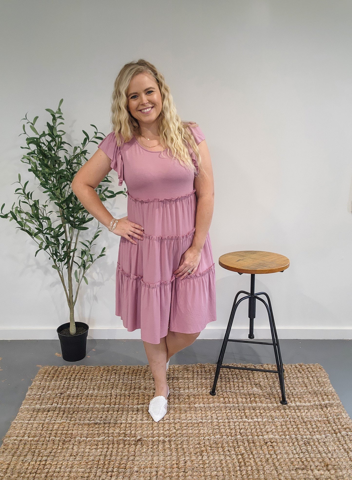 Front view of the ruffle sleeve tiered dress in light rose